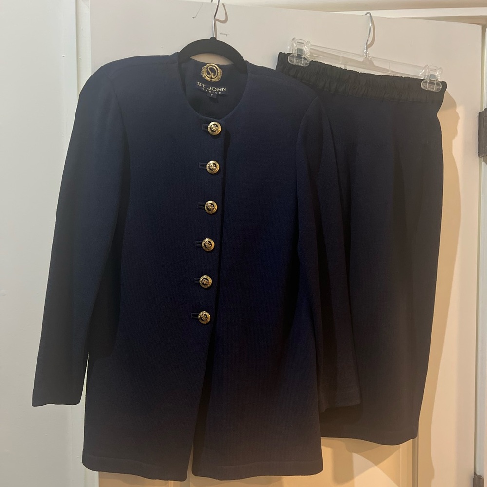 St. John two-piece set in navy blue with knit jacket and matching skirt.